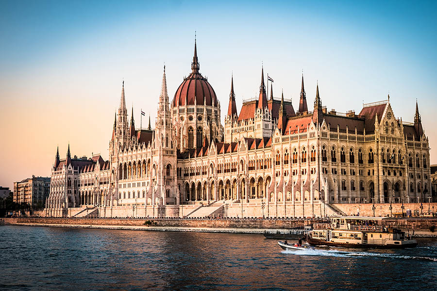 Hungarian Parliament Building illuminated at night reflected in the River Danube Budapest