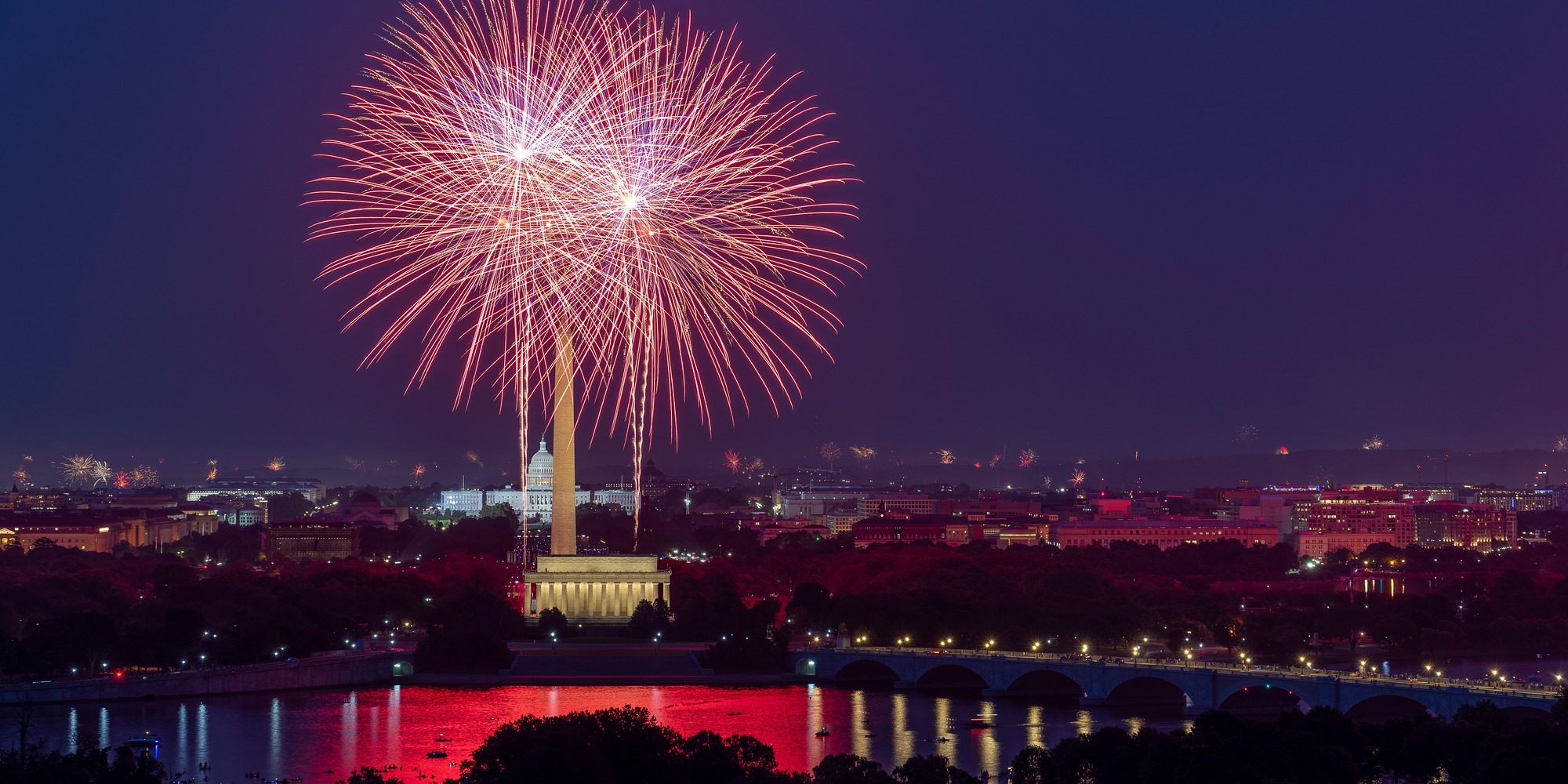 Fireworks explode over the Washington Monument and Lincoln Memorial during America's 250th Independence Day celebrations in Washington, DC